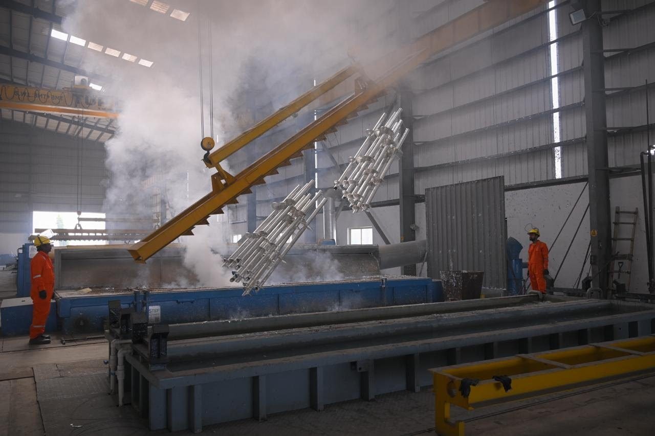 Steel being lifted from the hot-dip galvanizing bath at Miral Enterprise, Gandhidham
